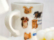 Load image into Gallery viewer, Cute cartoon puppy and cat characters are shown on playful, glossy stickers, placed on cups
